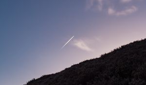 Preview wallpaper hill, plane, trail, smoke, sky