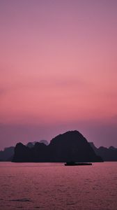 Preview wallpaper hill, rocks, sea, evening, pink