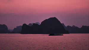 Preview wallpaper hill, rocks, sea, evening, pink