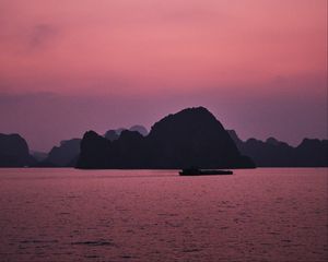 Preview wallpaper hill, rocks, sea, evening, pink