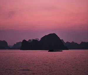 Preview wallpaper hill, rocks, sea, evening, pink