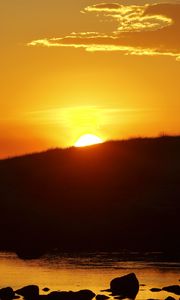 Preview wallpaper hill, sea, stones, sunset, nature