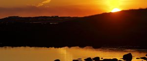 Preview wallpaper hill, sea, stones, sunset, nature