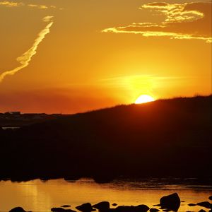 Preview wallpaper hill, sea, stones, sunset, nature