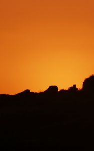Preview wallpaper hill, silhouette, sky, sunset, evening
