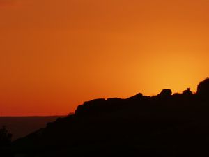 Preview wallpaper hill, silhouette, sky, sunset, evening