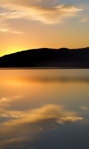 Preview wallpaper hill, silhouette, sunset, water, reflection