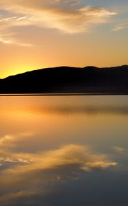 Preview wallpaper hill, silhouette, sunset, water, reflection