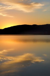 Preview wallpaper hill, silhouette, sunset, water, reflection