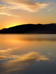 Preview wallpaper hill, silhouette, sunset, water, reflection