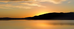 Preview wallpaper hill, silhouette, sunset, water, reflection