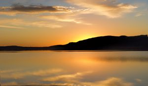 Preview wallpaper hill, silhouette, sunset, water, reflection