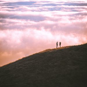 Preview wallpaper hill, silhouettes, clouds