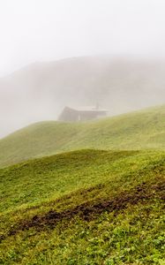 Preview wallpaper hill, slope, grass, house, fog