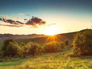 Preview wallpaper hill, slope, rays, grass, sun
