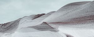 Preview wallpaper hill, snowdrift, loose, wavy, hilly, gray