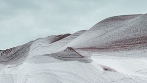 Preview wallpaper hill, snowdrift, loose, wavy, hilly, gray