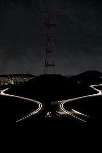 Preview wallpaper hill, tower, night, lights, road, dark