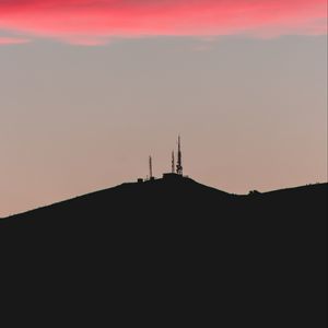 Preview wallpaper hill, tower, sunset, silhouette