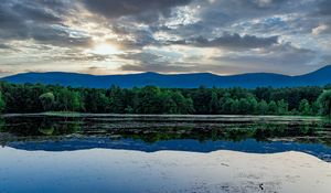 Preview wallpaper hill, water, trees, reflected, rays