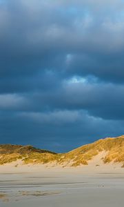 Preview wallpaper hills, beach, clouds, sky, dark, landscape
