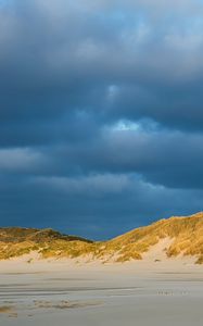 Preview wallpaper hills, beach, clouds, sky, dark, landscape