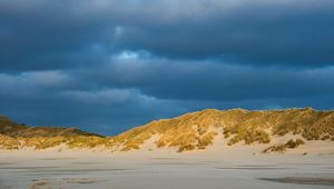 Preview wallpaper hills, beach, clouds, sky, dark, landscape