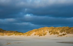 Preview wallpaper hills, beach, clouds, sky, dark, landscape