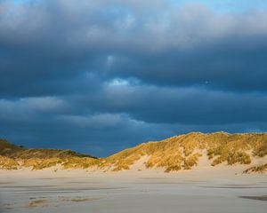 Preview wallpaper hills, beach, clouds, sky, dark, landscape