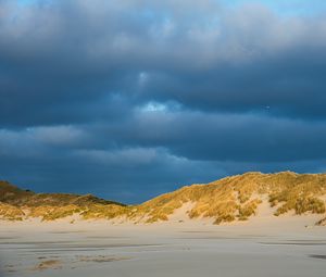 Preview wallpaper hills, beach, clouds, sky, dark, landscape