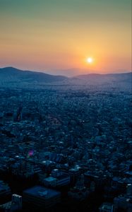 Preview wallpaper hills, city, aerial view, sunrise