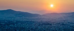 Preview wallpaper hills, city, aerial view, sunrise