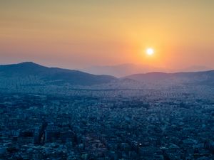 Preview wallpaper hills, city, aerial view, sunrise