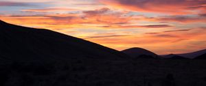 Preview wallpaper hills, clouds, sky, sunset, dark