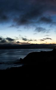 Preview wallpaper hills, coast, sea, silhouettes, evening
