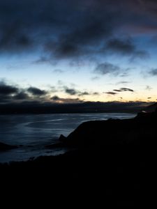 Preview wallpaper hills, coast, sea, silhouettes, evening