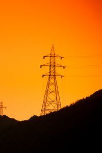 Preview wallpaper hills, electric poles, dusk, sunset, orange