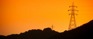 Preview wallpaper hills, electric poles, dusk, sunset, orange