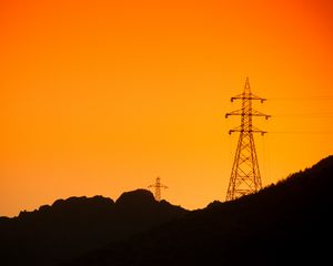 Preview wallpaper hills, electric poles, dusk, sunset, orange