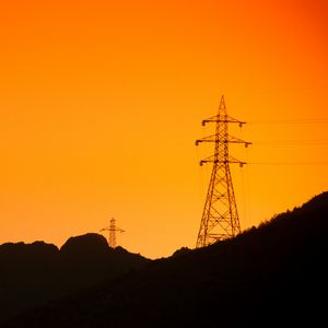 Preview wallpaper hills, electric poles, dusk, sunset, orange