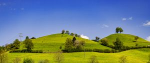 Preview wallpaper hills, field, trees, clouds, landscape