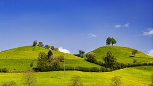 Preview wallpaper hills, field, trees, clouds, landscape