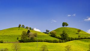 Preview wallpaper hills, field, trees, clouds, landscape