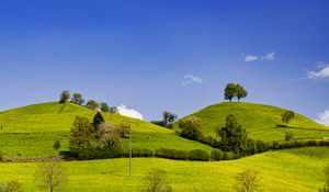 Preview wallpaper hills, field, trees, clouds, landscape