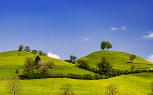 Preview wallpaper hills, field, trees, clouds, landscape