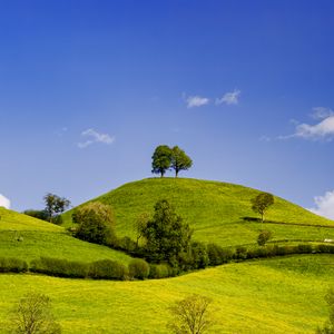 Preview wallpaper hills, field, trees, clouds, landscape