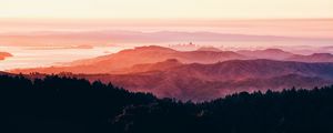 Preview wallpaper hills, fog, city, sunrise