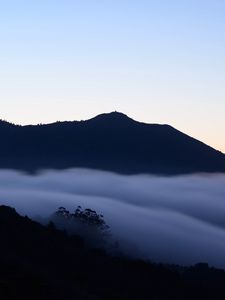 Preview wallpaper hills, fog, clouds, dark, sunrise