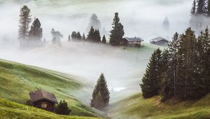 Preview wallpaper hills, fog, trees, buildings, slope