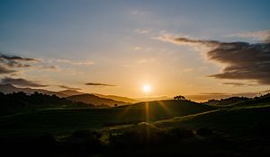 Preview wallpaper hills, grass, dawn, sky, clouds, nature